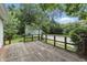 Wooden back deck with view of large backyard at 6125 Winthrop Ave, Indianapolis, IN 46220