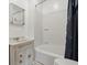 Bathroom featuring a shower, vanity, mirror, and toilet at 6125 Winthrop Ave, Indianapolis, IN 46220