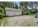 Detached two-car garage with a large driveway and a tidy exterior at 6125 Winthrop Ave, Indianapolis, IN 46220