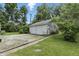 Two-car garage with peeling white paint at 6125 Winthrop Ave, Indianapolis, IN 46220