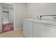 Laundry room with washer and dryer, featuring doorway to other rooms at 6125 Winthrop Ave, Indianapolis, IN 46220