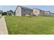 Large backyard with grass and an open view of other homes in the neighborhood at 680 Albermarle Dr, Pittsboro, IN 46167