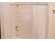 Bright bathroom with tiled tub and shower featuring a shower curtain at 680 Albermarle Dr, Pittsboro, IN 46167
