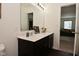 Modern bathroom with dual sinks, sleek vanity, and contemporary accents at 680 Albermarle Dr, Pittsboro, IN 46167