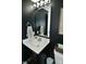 Modern bathroom showcasing dark walls, marble countertop and stylish fixtures at 680 Albermarle Dr, Pittsboro, IN 46167