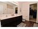 Modern bathroom featuring dual sinks, spacious vanity, and a walk-in closet at 680 Albermarle Dr, Pittsboro, IN 46167