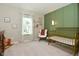 Sweet Bedroom featuring a decorative green accent wall and classic crib at 680 Albermarle Dr, Pittsboro, IN 46167