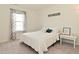 Bright bedroom featuring a comfortable bed, a large window, and modern decor at 680 Albermarle Dr, Pittsboro, IN 46167