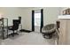 Bright bedroom with modern desk and cozy Papasan chair near a window with nice view at 680 Albermarle Dr, Pittsboro, IN 46167
