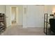 Bedroom with a closet featuring sliding doors, neutral carpet, and adjacent hallway at 680 Albermarle Dr, Pittsboro, IN 46167