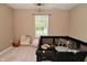 Neutral carpeted room with a bright window, whimsical decor and playful learning books at 680 Albermarle Dr, Pittsboro, IN 46167