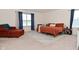Bedroom showcasing a comfortable bed, a cozy chair, and bright natural light at 680 Albermarle Dr, Pittsboro, IN 46167