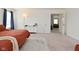 Carpeted bedroom with a door leading to the living room and natural light at 680 Albermarle Dr, Pittsboro, IN 46167