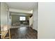 Inviting entryway with hardwood floors that leads into the living room with cozy seating and natural light at 680 Albermarle Dr, Pittsboro, IN 46167