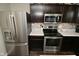 Bright kitchen features stainless steel appliances, white countertops, and modern backsplash at 680 Albermarle Dr, Pittsboro, IN 46167