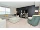 Inviting living room with a comfortable sectional, a cozy fireplace, and stylish decor at 680 Albermarle Dr, Pittsboro, IN 46167