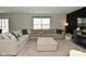 Living room featuring a large sectional, a cozy fireplace and decor at 680 Albermarle Dr, Pittsboro, IN 46167