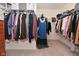 Spacious walk-in closet with ample hanging space, shelving, and carpeted floor at 680 Albermarle Dr, Pittsboro, IN 46167