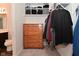 Walk-in closet with built-in shelves and a dresser for storage near bathroom at 680 Albermarle Dr, Pittsboro, IN 46167