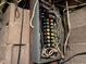 Close-up of the electrical panel showing breakers and wiring at 712 Cottage Ave, Anderson, IN 46012