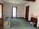 Cozy living room featuring a vintage sofa, fireplace, and natural lighting at 712 Cottage Ave, Anderson, IN 46012
