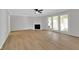 Bright living room featuring a fireplace, ceiling fan, and access to the outdoor space at 716 Royal Troon Ct, Avon, IN 46123