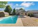 Backyard view of inground pool, custom pergola and patio at 716 Royal Troon Ct, Avon, IN 46123