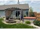 Outdoor oasis featuring a patio with an arbor, a fire pit, and a hot tub surrounded by lush landscaping at 7175 Oakview Dr, Avon, IN 46123