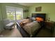 A light-filled bedroom with a large window and charming decor at 7175 Oakview Dr, Avon, IN 46123
