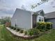 A charming home exterior showcases a brick accent, manicured landscaping, and a well-maintained lawn at 7175 Oakview Dr, Avon, IN 46123