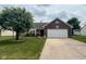 Charming single-story brick home with mature landscaping and a two-car attached garage at 7175 Oakview Dr, Avon, IN 46123