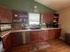 The kitchen features wooden cabinets, stainless steel appliances and laminate countertops at 7175 Oakview Dr, Avon, IN 46123