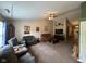 Comfortable living room featuring carpet, a ceiling fan, and plenty of natural light at 7175 Oakview Dr, Avon, IN 46123