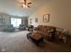 Spacious living room with carpet, a ceiling fan, and ample seating at 7175 Oakview Dr, Avon, IN 46123