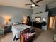 Spacious primary bedroom with a ceiling fan, ensuite bath and chest at the foot of the bed at 7175 Oakview Dr, Avon, IN 46123