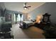 A spacious primary bedroom with an ensuite bathroom featuring a ceiling fan and sitting area at 7175 Oakview Dr, Avon, IN 46123