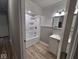 Bright bathroom featuring a shower-tub combo with white fixtures and modern vanity at 724 Iroquois St, Anderson, IN 46012