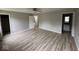 This bedroom features neutral walls, a ceiling fan and wood-look laminate floors at 724 Iroquois St, Anderson, IN 46012