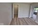 A room with neutral tones, showcasing durable floors, and an accessible closet at 724 Iroquois St, Anderson, IN 46012