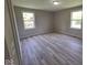 Bright bedroom showing two windows and neutral wall paint at 724 Iroquois St, Anderson, IN 46012