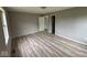 Spacious bedroom with neutral paint, modern floors, and large windows provides lots of light at 724 Iroquois St, Anderson, IN 46012