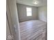 Bedroom with a bright window and neutral wall paint at 724 Iroquois St, Anderson, IN 46012