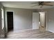 This bedroom features neutral walls, a ceiling fan and wood-look laminate floors at 724 Iroquois St, Anderson, IN 46012