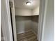 View of a walk-in closet with a shelf and fresh paint and modern floors at 724 Iroquois St, Anderson, IN 46012