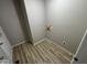 This is an image of a walk in closet featuring laminate flooring and a gray painted walls at 724 Iroquois St, Anderson, IN 46012