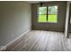 Dining room featuring wood-look flooring, neutral paint and a chandelier at 724 Iroquois St, Anderson, IN 46012