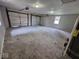 Large garage with concrete flooring and two doors at 724 Iroquois St, Anderson, IN 46012