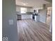 A modern kitchen showcasing white cabinets, stainless steel appliances, and durable flooring at 724 Iroquois St, Anderson, IN 46012