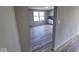 An open kitchen view from the living room featuring white cabinets and stainless steel appliances at 724 Iroquois St, Anderson, IN 46012