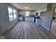 Charming kitchen boasts white cabinets, stainless steel appliances, and bright natural light at 724 Iroquois St, Anderson, IN 46012